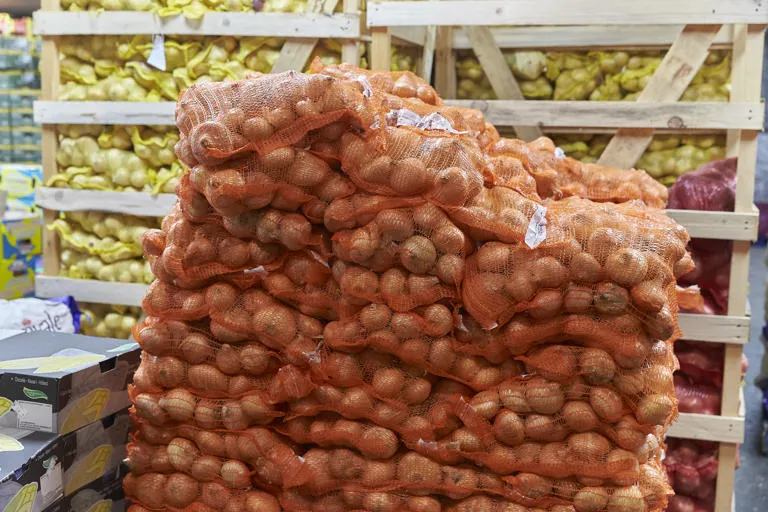 Bags of onions on a pallet