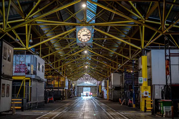 market hall with lit up clock