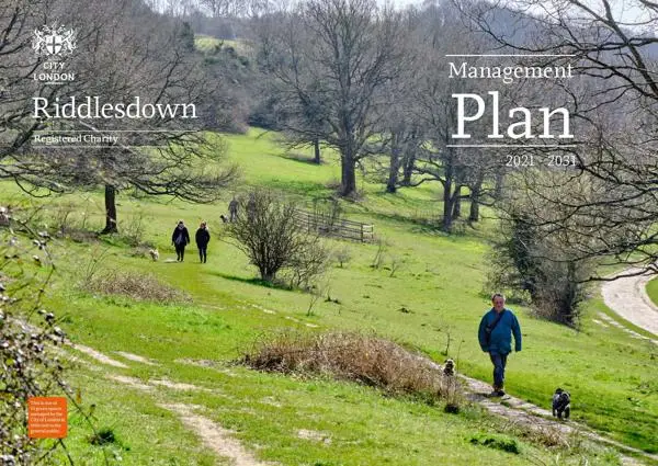 Cover image for the Riddlesdown Management Plan showing walkers on a green common with bare trees in winter