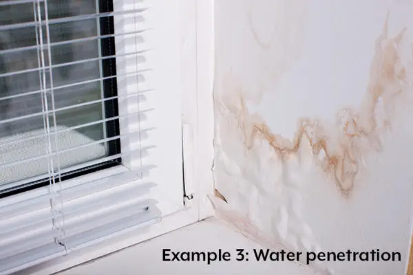 water seeping into walls by a window