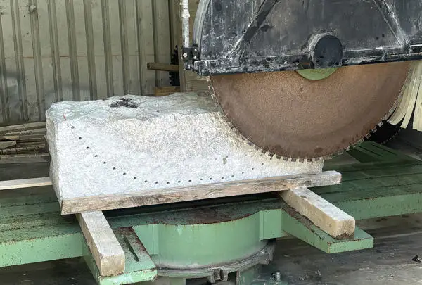 saw cutting a stone block