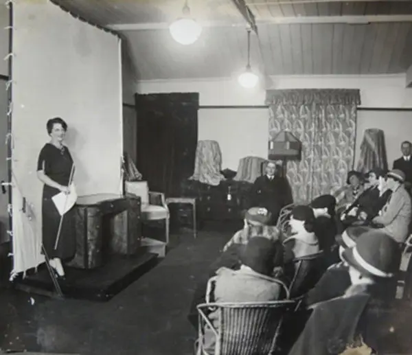 Betty Joel giving a furniture demonstration, 1930