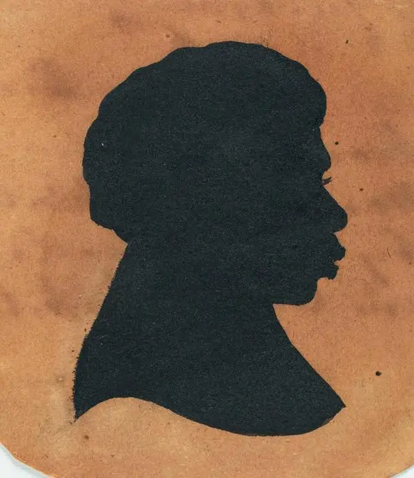 Silhouette image of the head and shoulders of Yemmerrawanyea facing right