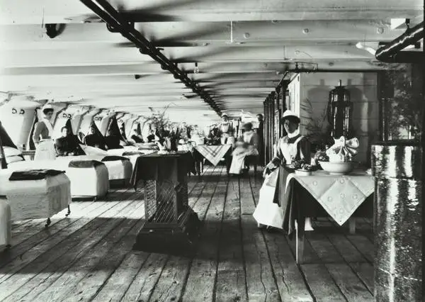 Ward deck of hospital ship Atlas, showing beds and nurses