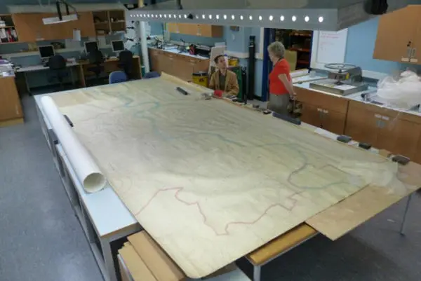 Large map spread out on a table, after conservation treatment