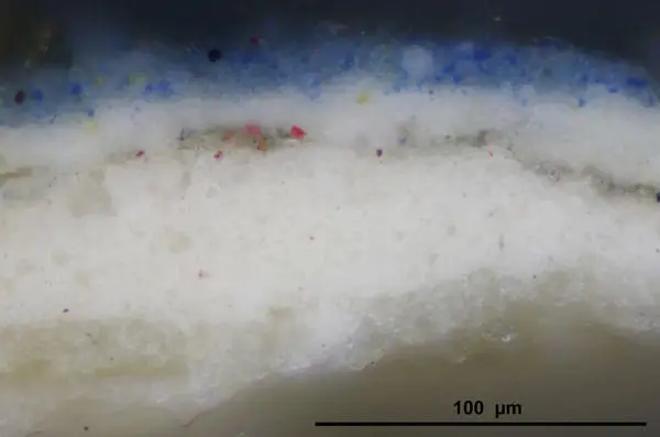 magnified paint sample of blues and whites with some red dots