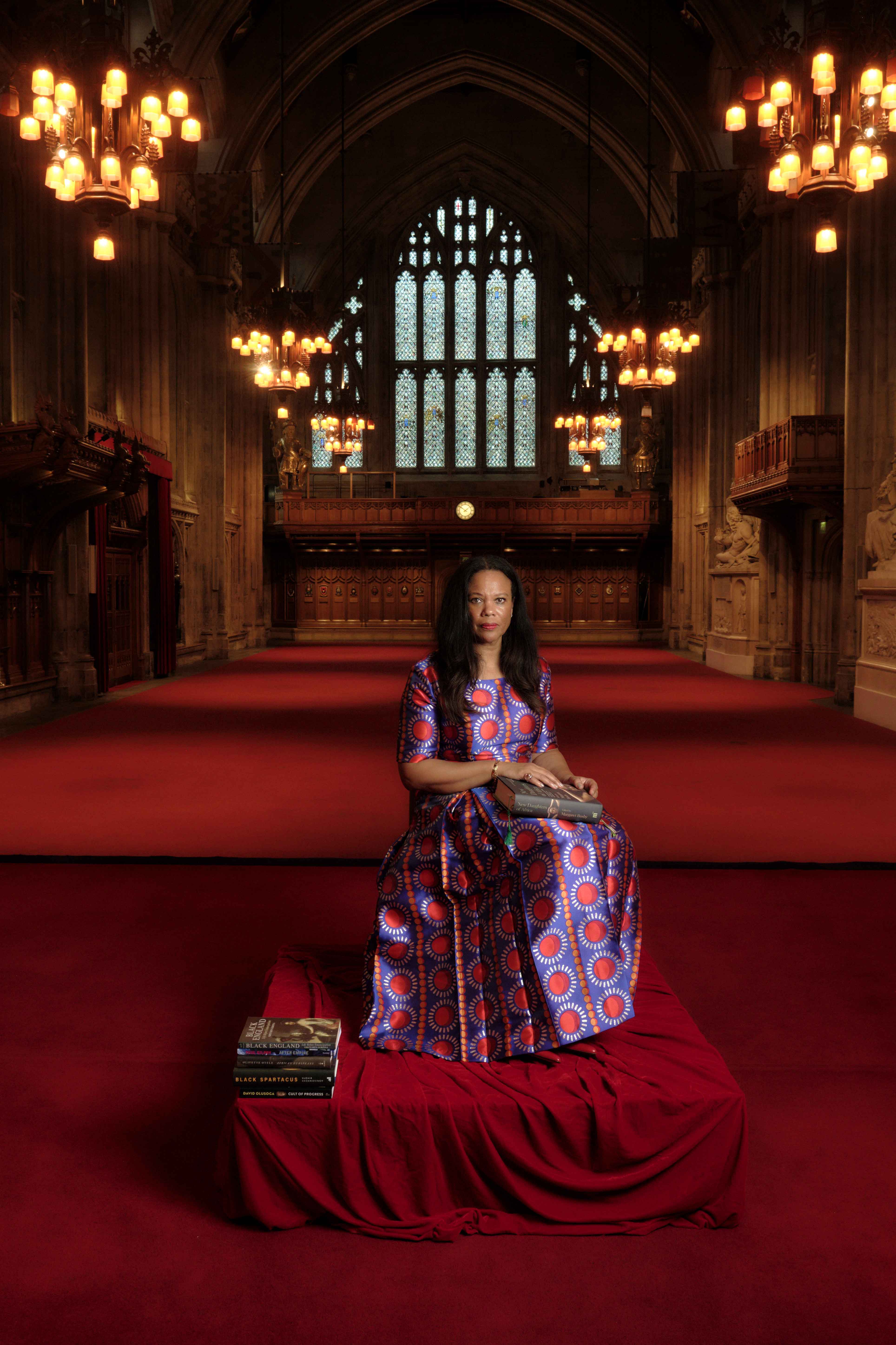 Angela, seated on the stage with her books, Main Hall
