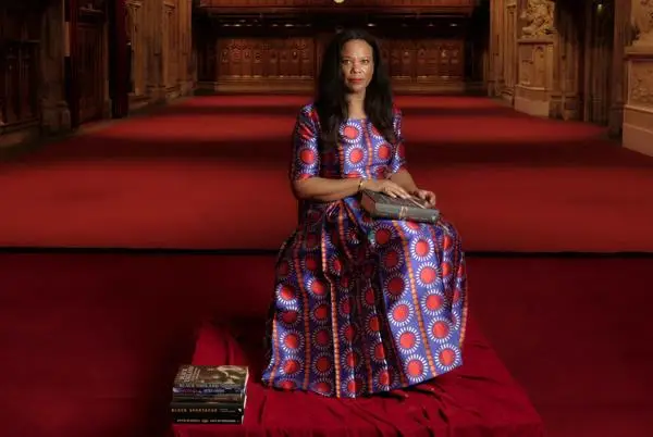 Angela, seated on the stage with her books, Main Hall