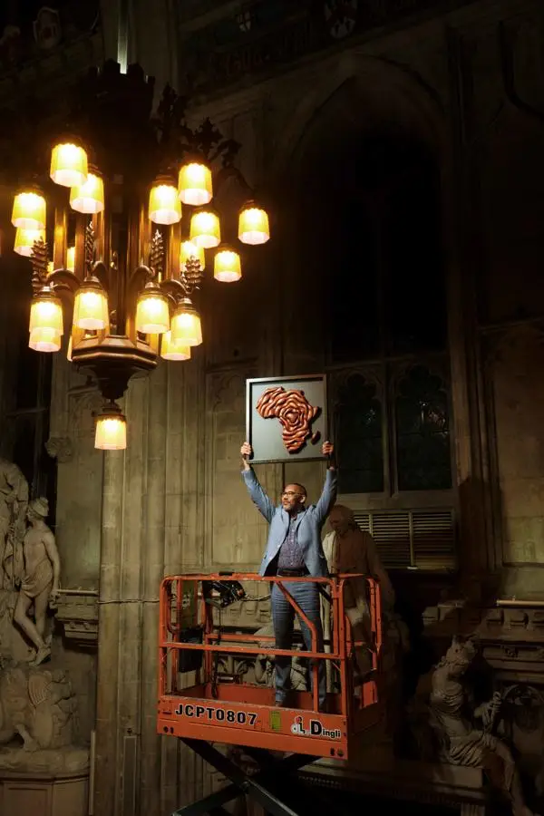 Bert holding a sculpture of the African continent