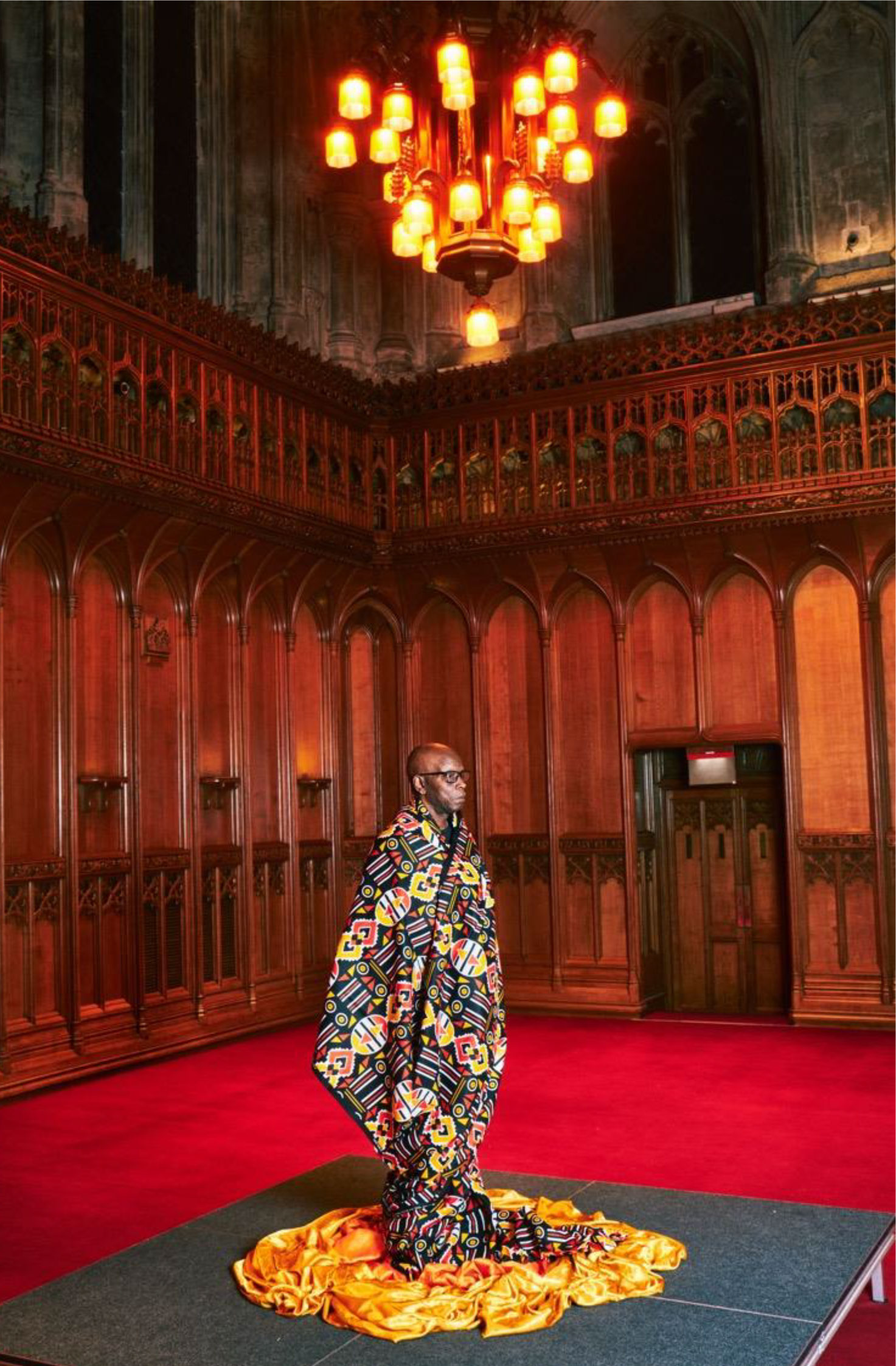 Dr Errol Francis, wrapped in Dutch wax fabric, Main Hall