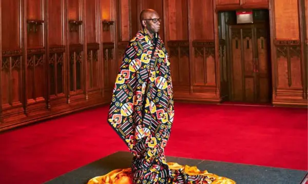 Dr Errol Francis, wrapped in Dutch wax fabric, Main Hall